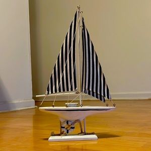 Wooden sailboat with cloth sails